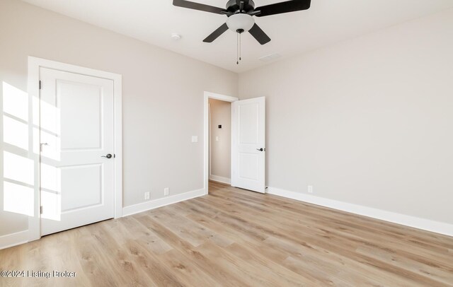 unfurnished bedroom featuring visible vents, baseboards, light wood-style flooring, and a ceiling fan