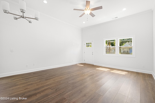 unfurnished room featuring ceiling fan with notable chandelier, dark hardwood / wood-style floors, and crown molding