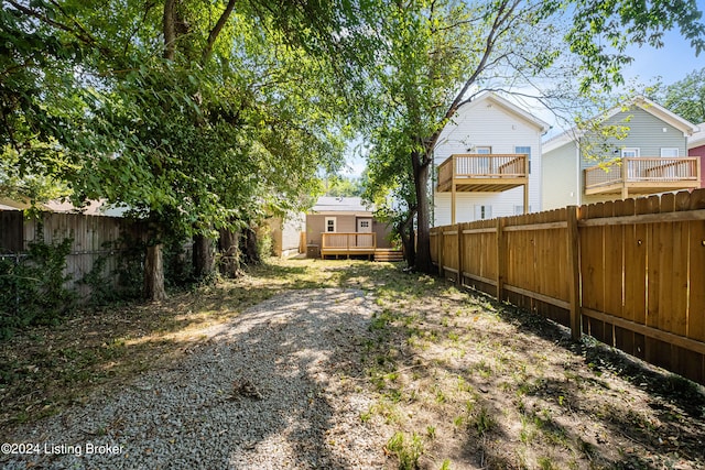 view of yard featuring a wooden deck