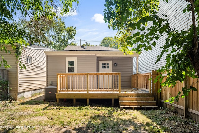 rear view of property with a deck and central air condition unit