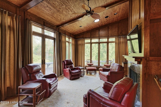 living area featuring carpet floors, french doors, lofted ceiling, a premium fireplace, and wood ceiling