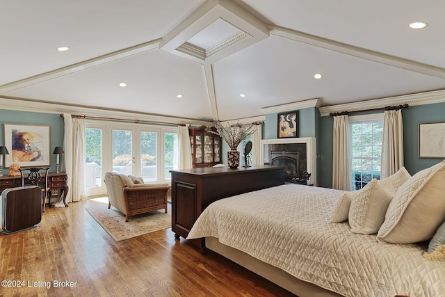 bedroom with crown molding, access to exterior, a fireplace, and wood finished floors