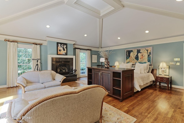 bedroom with dark wood-type flooring, ornamental molding, a premium fireplace, and vaulted ceiling with beams