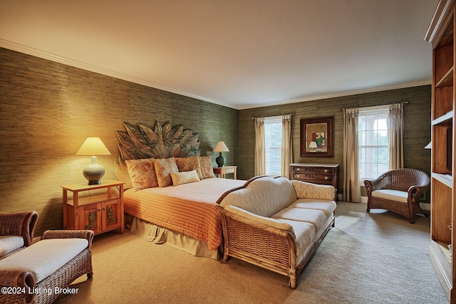 carpeted bedroom with ornamental molding
