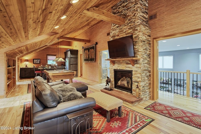 living area with wood ceiling, high vaulted ceiling, and light wood finished floors