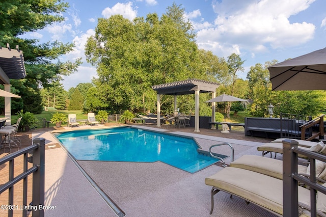 pool featuring a pergola and a patio