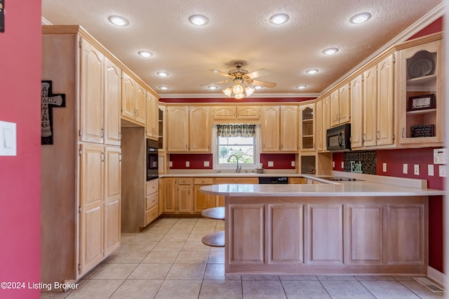 kitchen featuring black appliances, ceiling fan, light brown cabinetry, and light tile patterned flooring