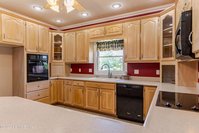 kitchen featuring black appliances, sink, light tile patterned floors, and ceiling fan