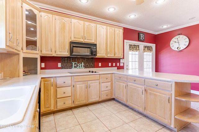 kitchen with black appliances, backsplash, kitchen peninsula, ornamental molding, and light tile patterned flooring