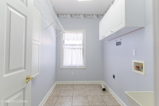 clothes washing area featuring washer hookup, light tile patterned floors, hookup for an electric dryer, and cabinets