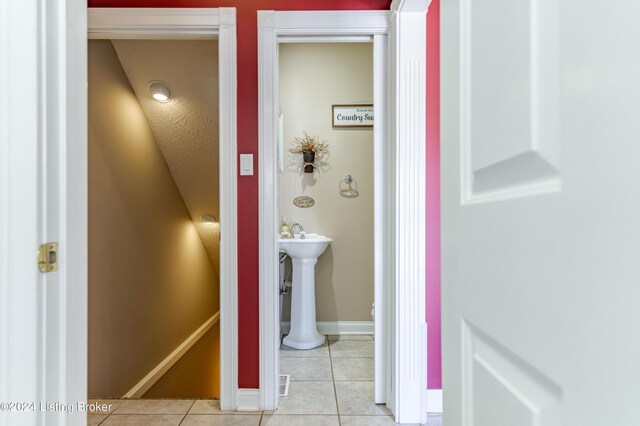 bathroom with tile patterned flooring and sink