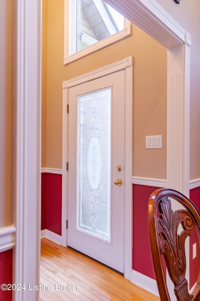 doorway with light wood-type flooring