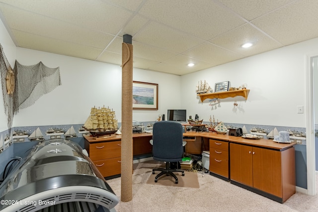 office area with light carpet and a paneled ceiling