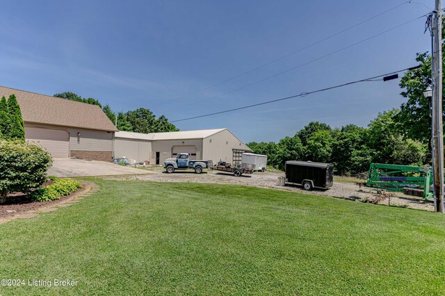 view of yard featuring a garage