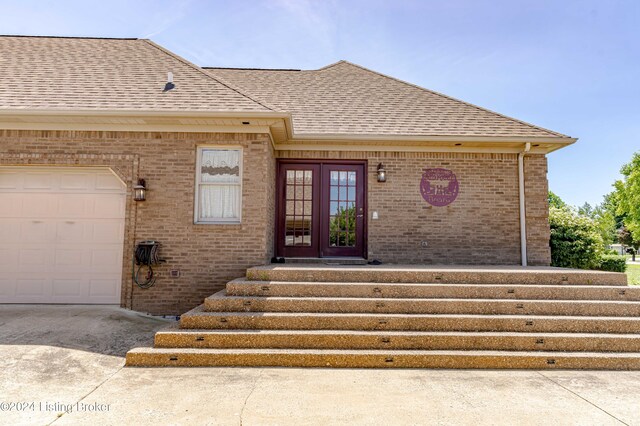 entrance to property featuring a garage