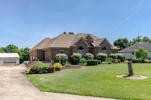 view of front of house with a garage and a front yard