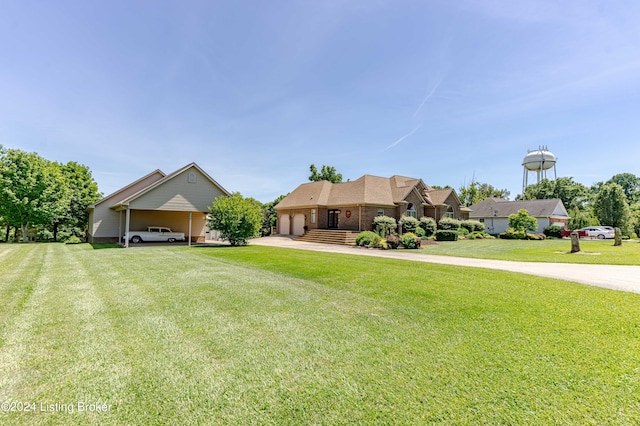 view of front of home with a carport and a front lawn