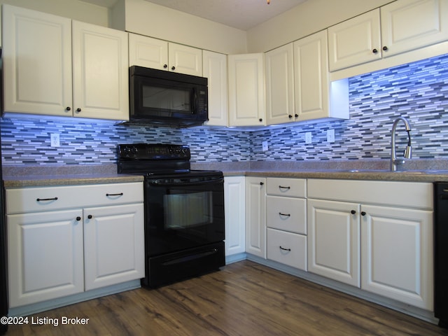 kitchen featuring sink, white cabinetry, backsplash, black appliances, and dark hardwood / wood-style flooring