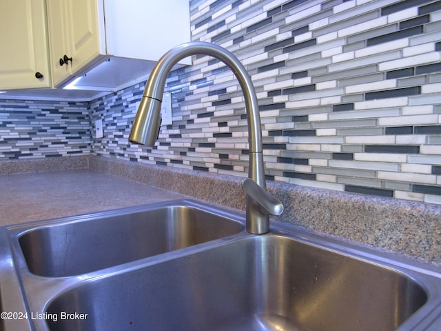 room details with decorative backsplash and sink