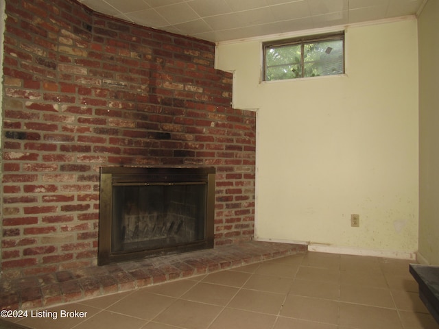 interior details featuring tile patterned flooring and a fireplace