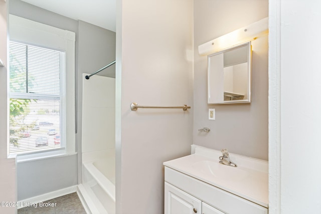 bathroom featuring vanity, bathing tub / shower combination, and tile patterned floors