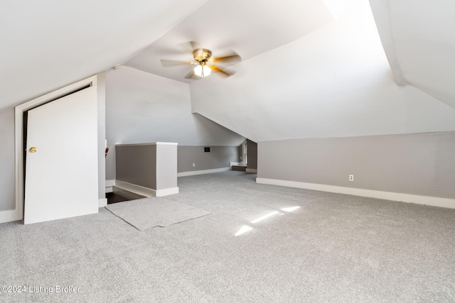 bonus room featuring ceiling fan, carpet flooring, and vaulted ceiling