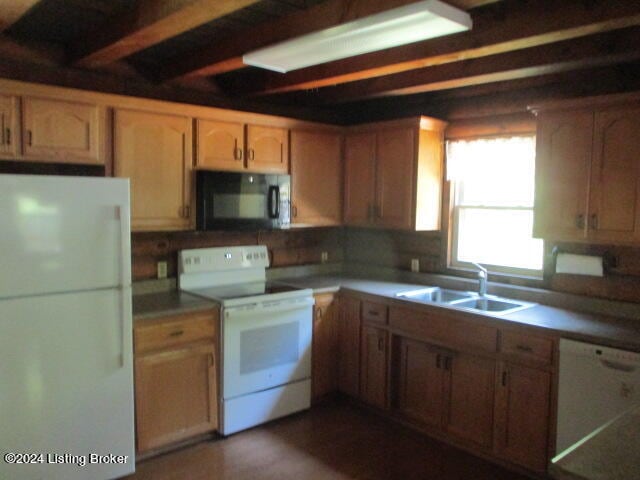 kitchen featuring sink and white appliances