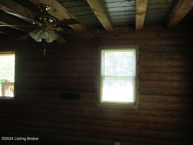 514 Eddie Miles Rd, New Haven, KY 40051 - interior details with rustic walls, wooden ceiling, ceiling fan, and beamed ceiling