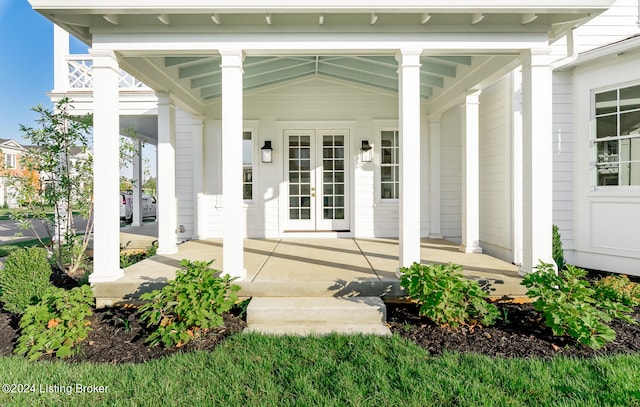 property entrance featuring a porch