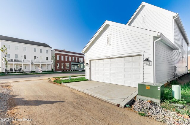 view of property exterior with a garage