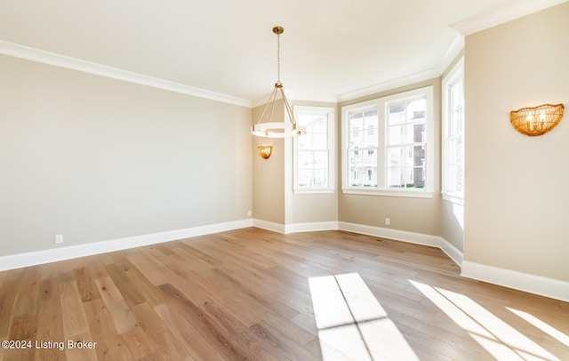 unfurnished dining area with crown molding and light hardwood / wood-style floors