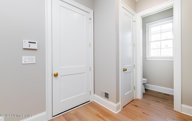 interior space featuring toilet and wood-type flooring