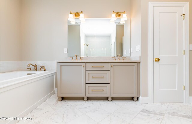 bathroom featuring vanity and independent shower and bath