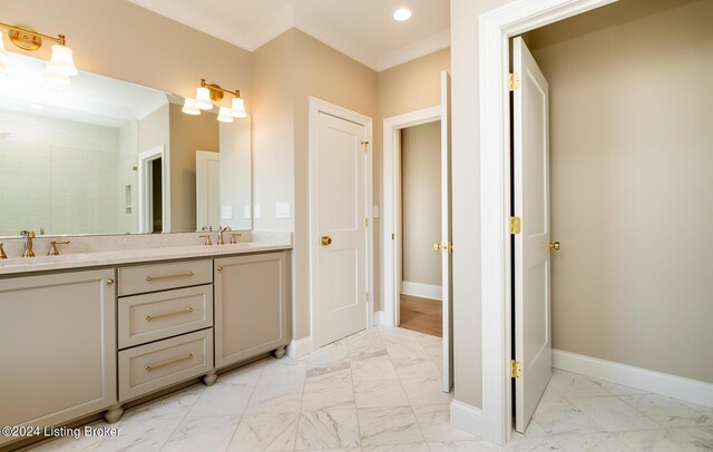 bathroom featuring vanity and ornamental molding