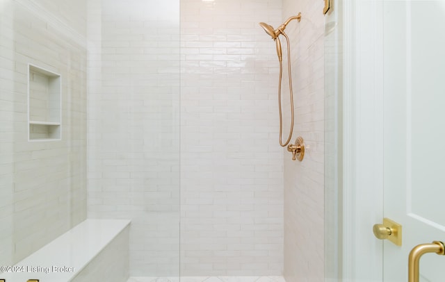 bathroom with a shower with shower door