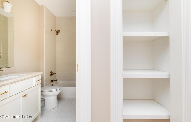 full bathroom featuring vanity, toilet, and tiled shower / bath combo