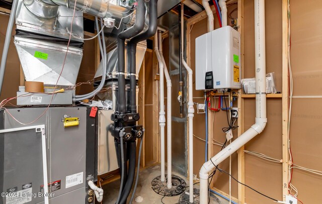 utility room with tankless water heater