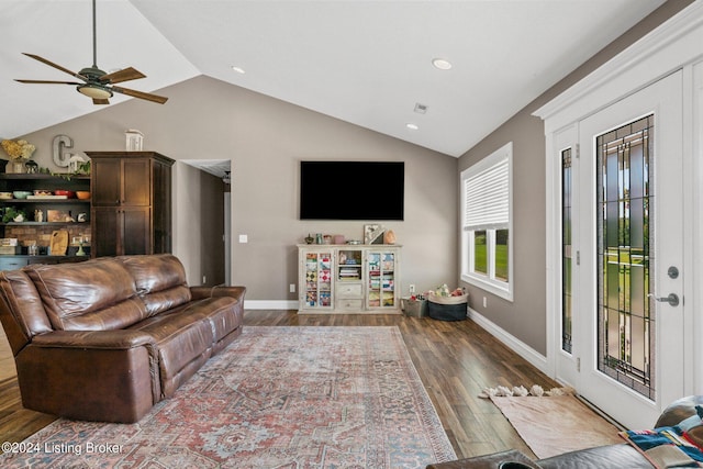 living room with baseboards, vaulted ceiling, wood finished floors, and recessed lighting