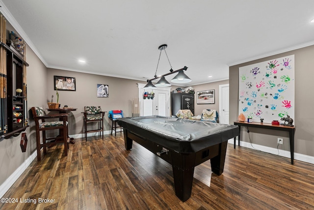 rec room with baseboards, crown molding, and wood finished floors