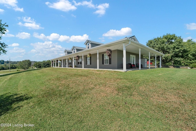 back of house with a yard