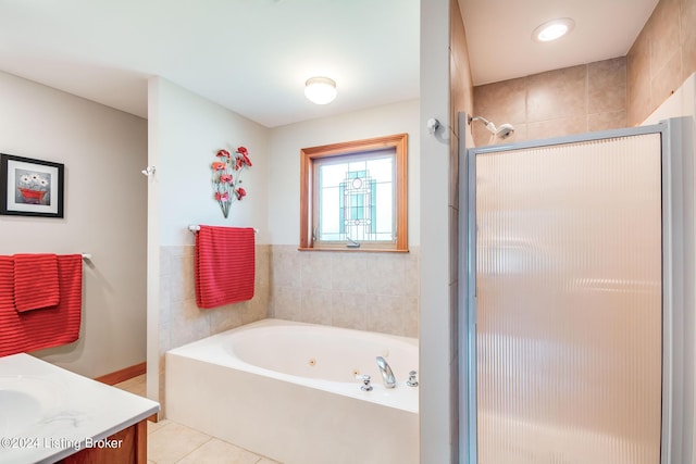 bathroom with tile patterned flooring, shower with separate bathtub, and vanity