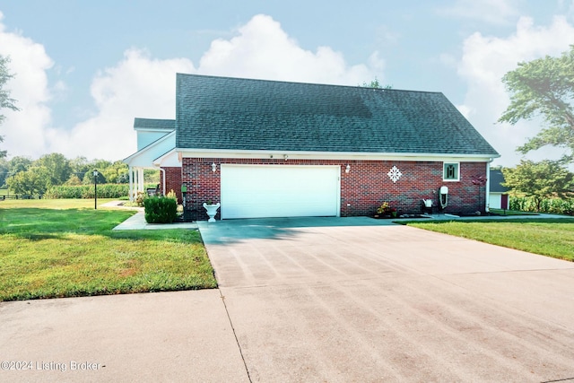 view of front facade with a garage and a front lawn