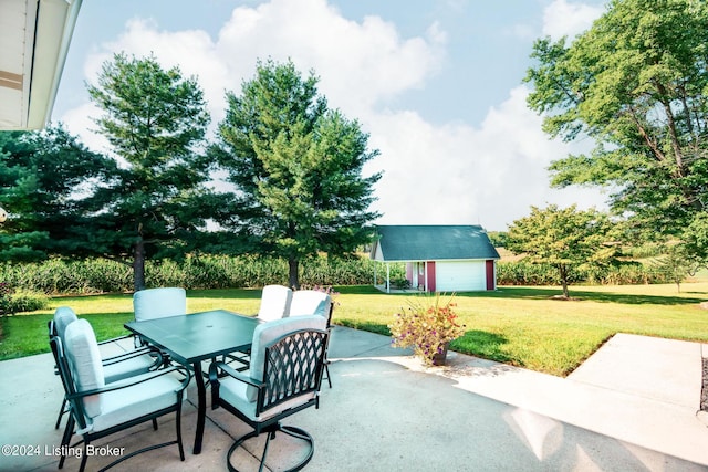 view of patio featuring an outdoor structure and a garage