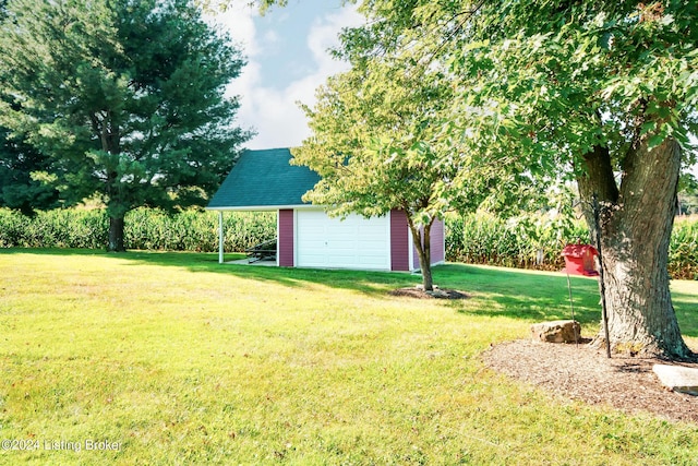 view of yard featuring a garage