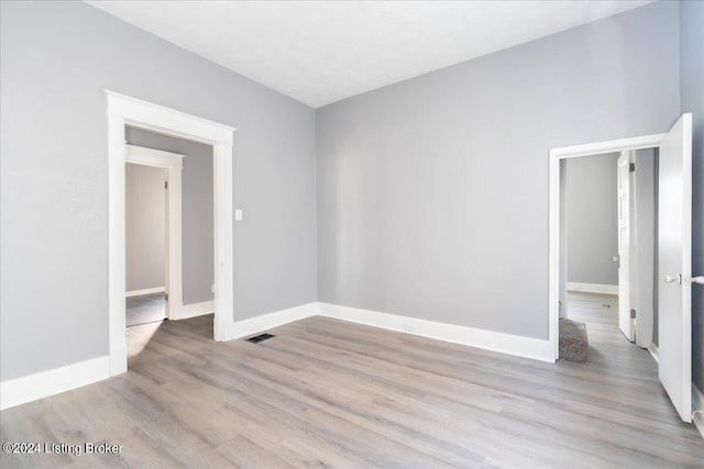 unfurnished room featuring light hardwood / wood-style flooring