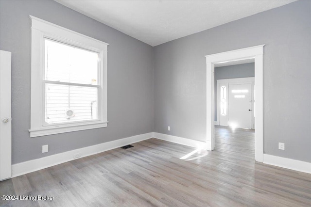 spare room with light hardwood / wood-style floors