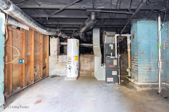 basement featuring water heater and heating unit