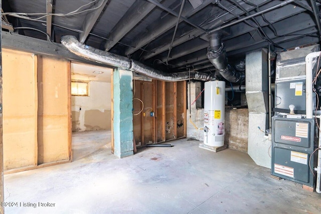 basement featuring heating unit and gas water heater