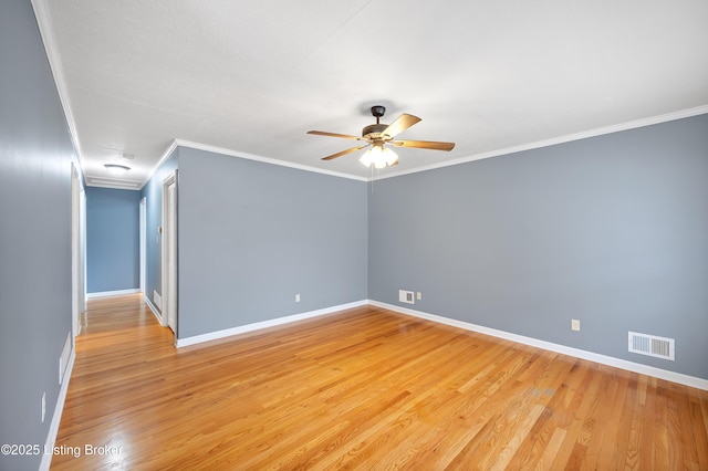 empty room with ornamental molding, ceiling fan, and light hardwood / wood-style floors