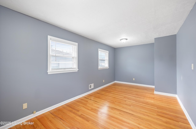 unfurnished room featuring light wood-type flooring